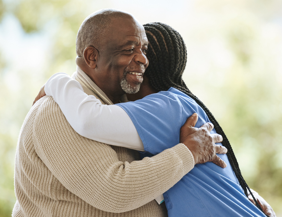Senior Man, Caregiver and Hug for Support, Healthcare and Happiness at Retirement Home. Happy Elderly Patient and Black Woman or Nurse Together for Trust, Homecare and Help for Health and Wellness